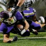 Lake Stevens Jayden Limar punches the ball into the end zone against Glacier Peak on Friday, Oct. 28, 2022, at Lake Stevens High School in Lake Stevens, Washington. (Ryan Berry / The Herald)