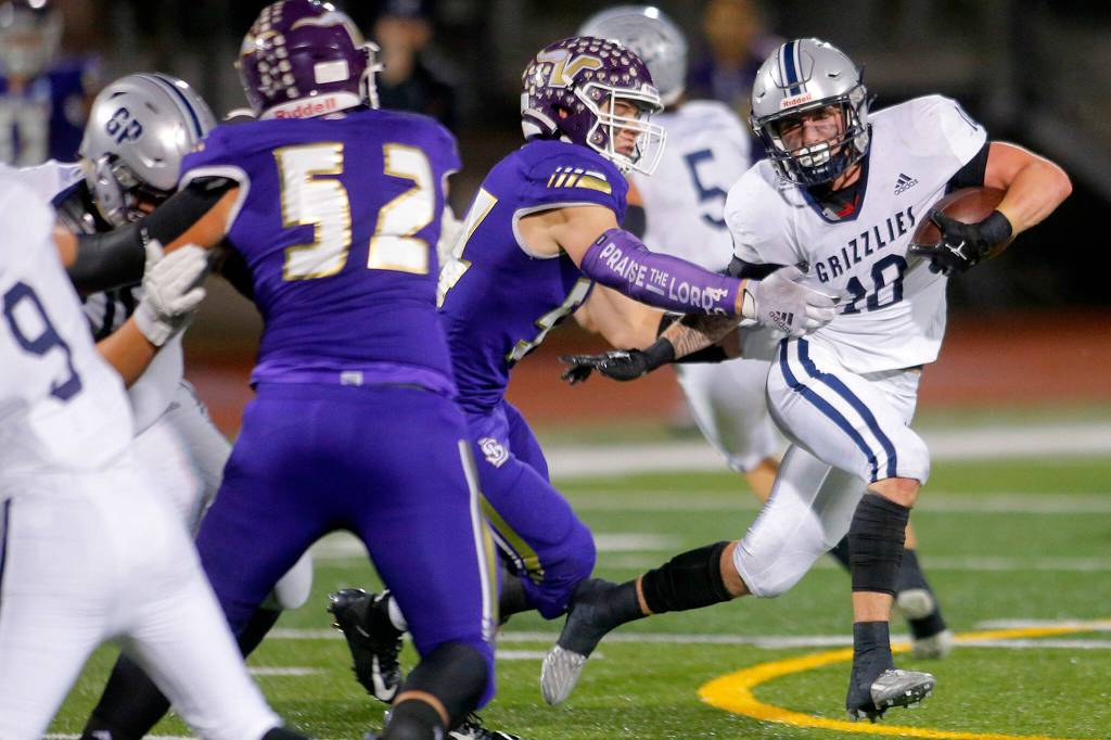 Glacier Peaks Ryan King tries to beat a defender around the edge against Lake Stevens on Friday, Oct. 28, 2022, at Lake Stevens High School in Lake Stevens, Washington. (Ryan Berry / The Herald)