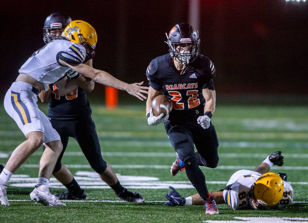 Monroes Jack Irwin escapes multiple tackles during the game against Ferndale on Friday, Oct. 28, 2022 in Monroe, Washington. (Olivia Vanni / The Herald)