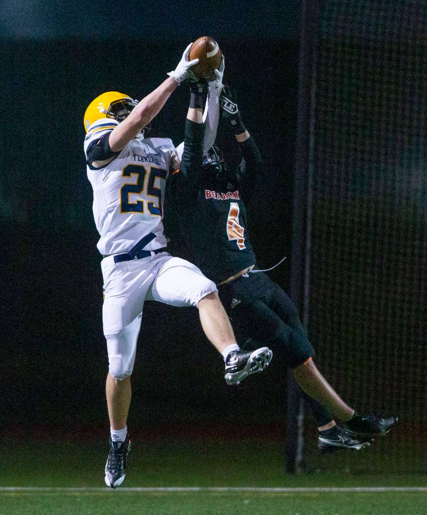 Monroes Gavin Ranz jumps to try and stop a catch during the game against Ferndale on Friday, Oct. 28, 2022 in Monroe, Washington. (Olivia Vanni / The Herald)