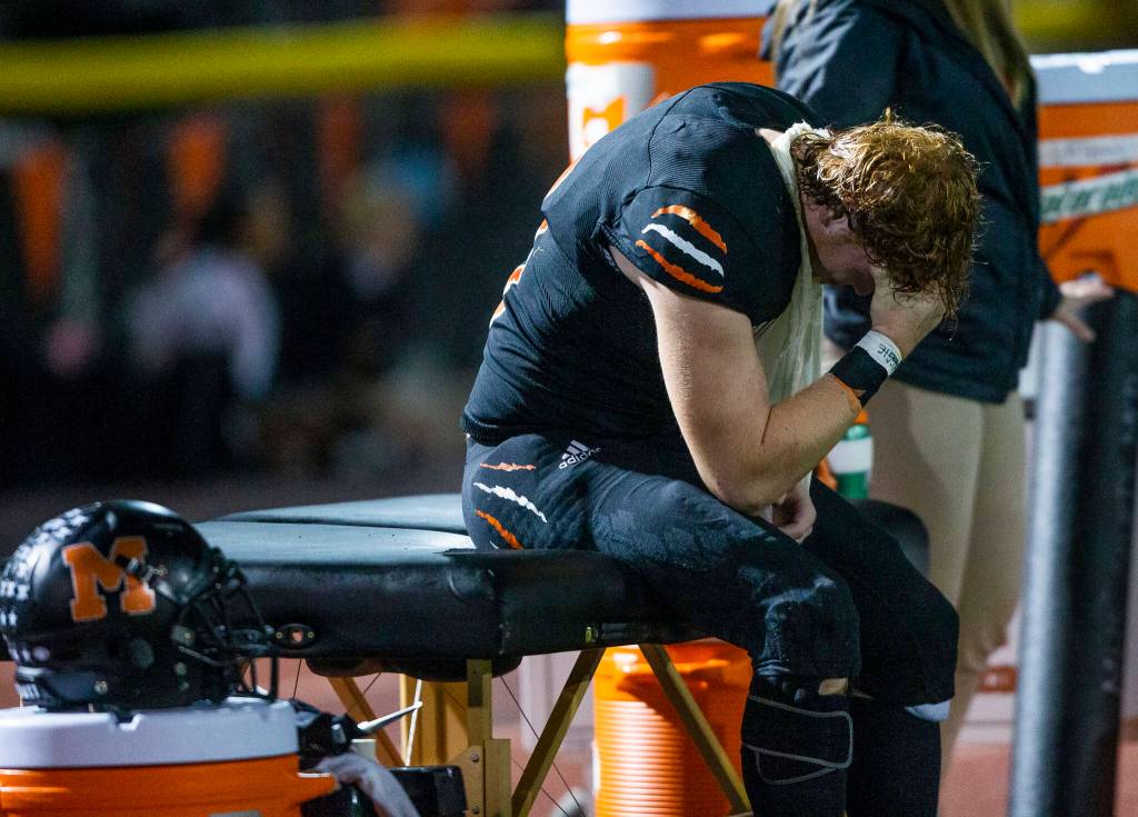 A Monroe player becomes emotional on the sideline after coming out of the game due to injury during the game against Ferndale on Friday, Oct. 28, 2022 in Monroe, Washington. (Olivia Vanni / The Herald)