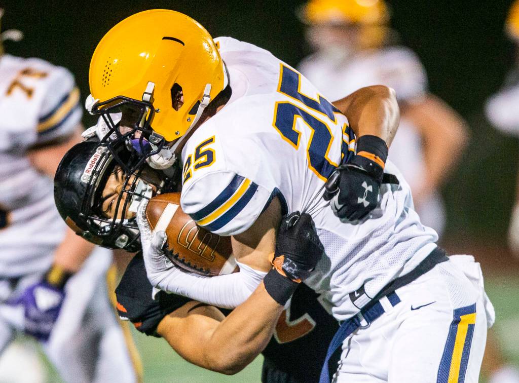 Monroes Palepoi Notoa completes a tackle during the game against Ferndale on Friday, Oct. 28, 2022 in Monroe, Washington. (Olivia Vanni / The Herald)