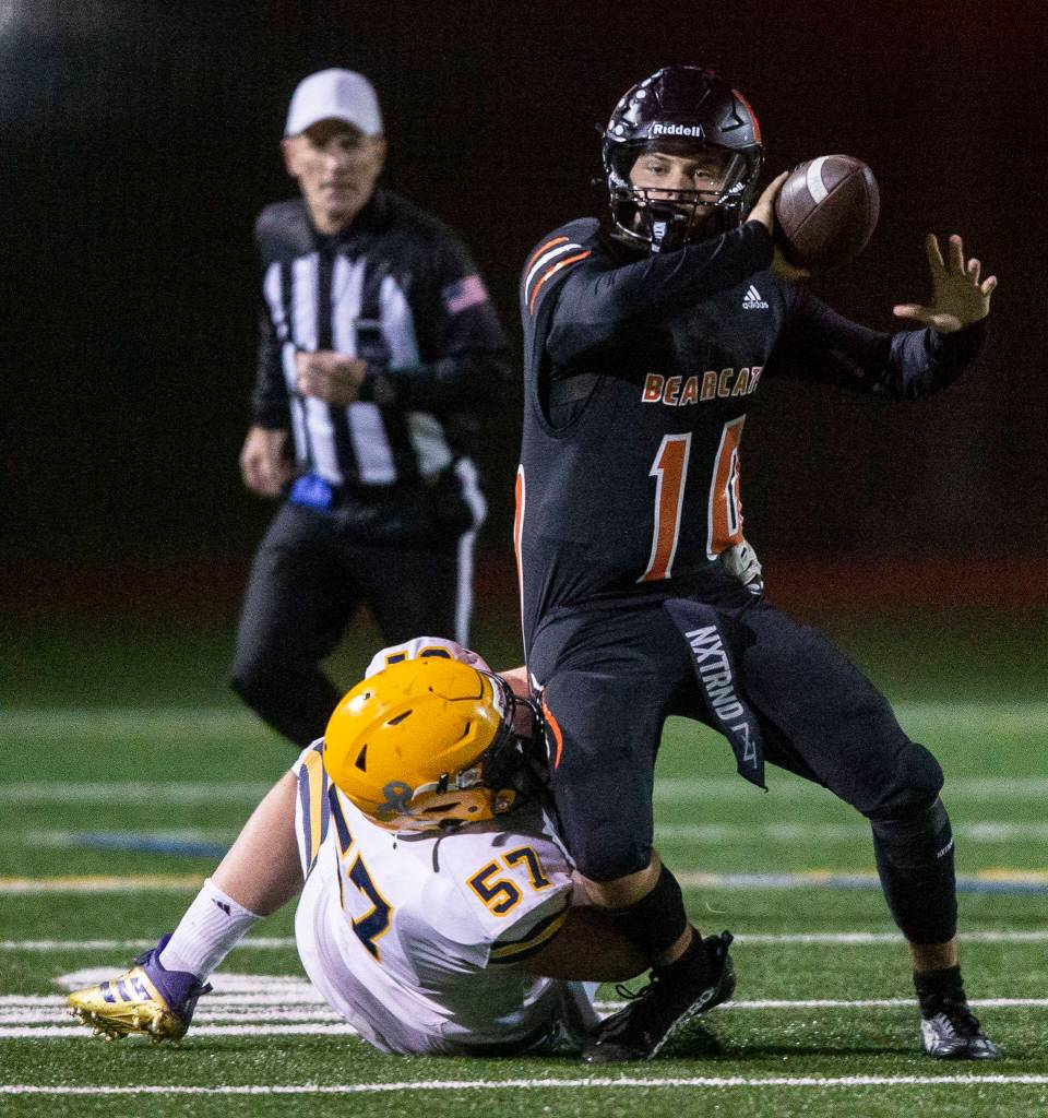 Monroes Blake Springer is sacked during the game against Ferndale on Friday, Oct. 28, 2022 in Monroe, Washington. (Olivia Vanni / The Herald)