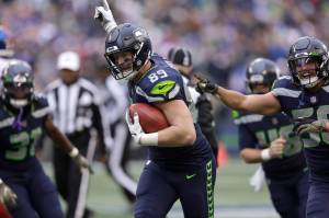 The Seattle Seahawks Will Dissly (89) celebrates after recovering a fumble on a New York Giants punt return during the second half of Sundays game in Seattle. (AP Photo/John Froschauer)