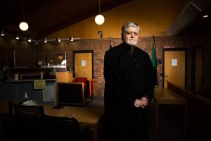District Court Judge Steven Clough stands in the courtroom at Evergreen Division of Snohomish County District Court on Tuesday, Aug. 24, 2021 in Monroe, Washington. Clough has been a judge since 1978, making him the longest-serving elected official in Snohomish County. (Andy Bronson / The Herald)
