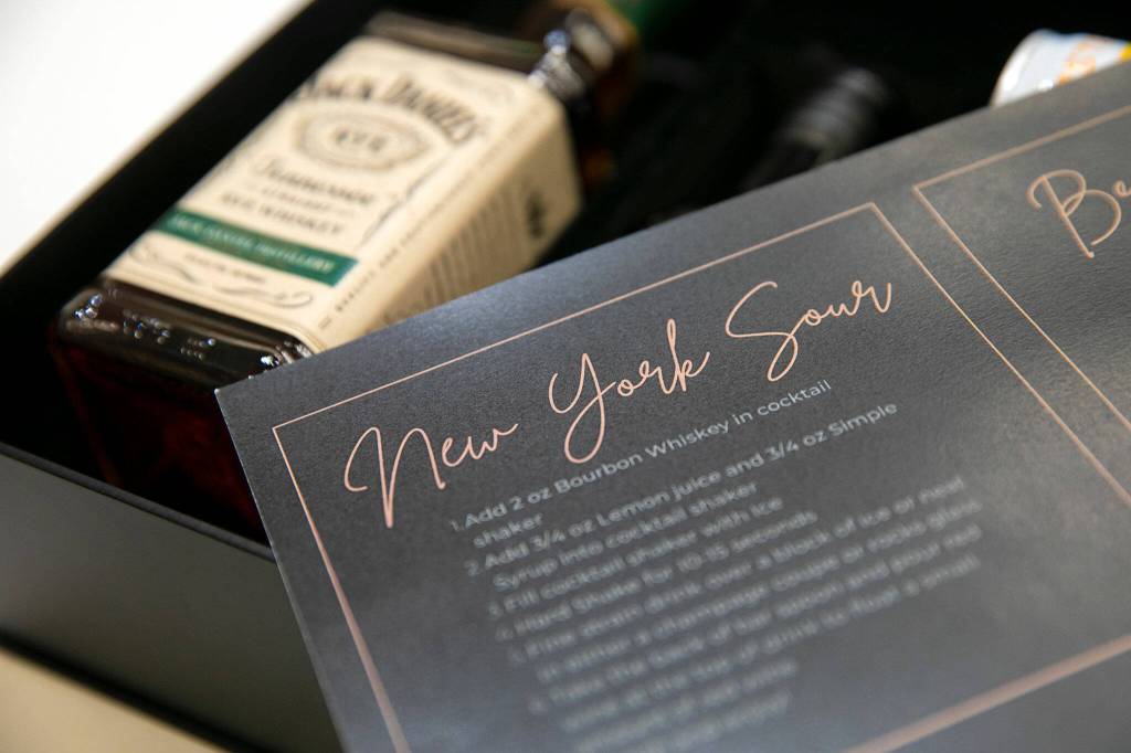 Instructions come with a Revolution by the Barrel cocktail kit on Nov. 6, at Think Tank Cowork in Everett. (Ryan Berry / The Herald)