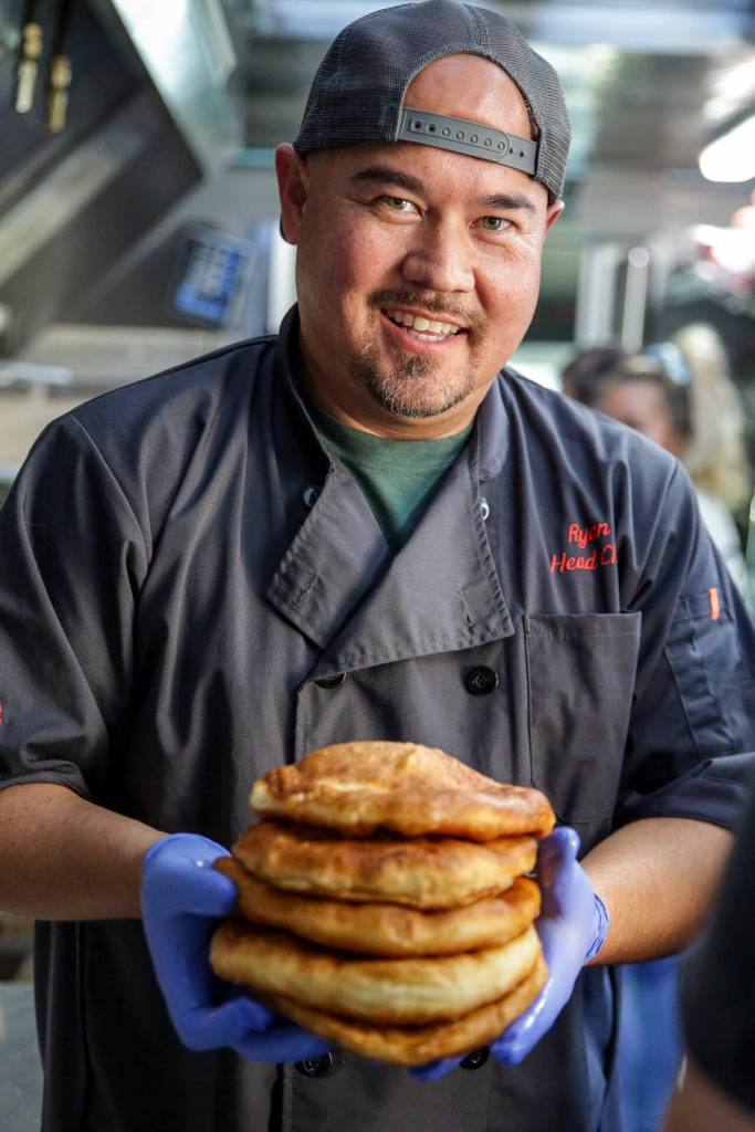 Ryan Gobin, owner of Ryans REZ-ipes, with a fresh stack of frybread. (Kevin Clark / The Herald)