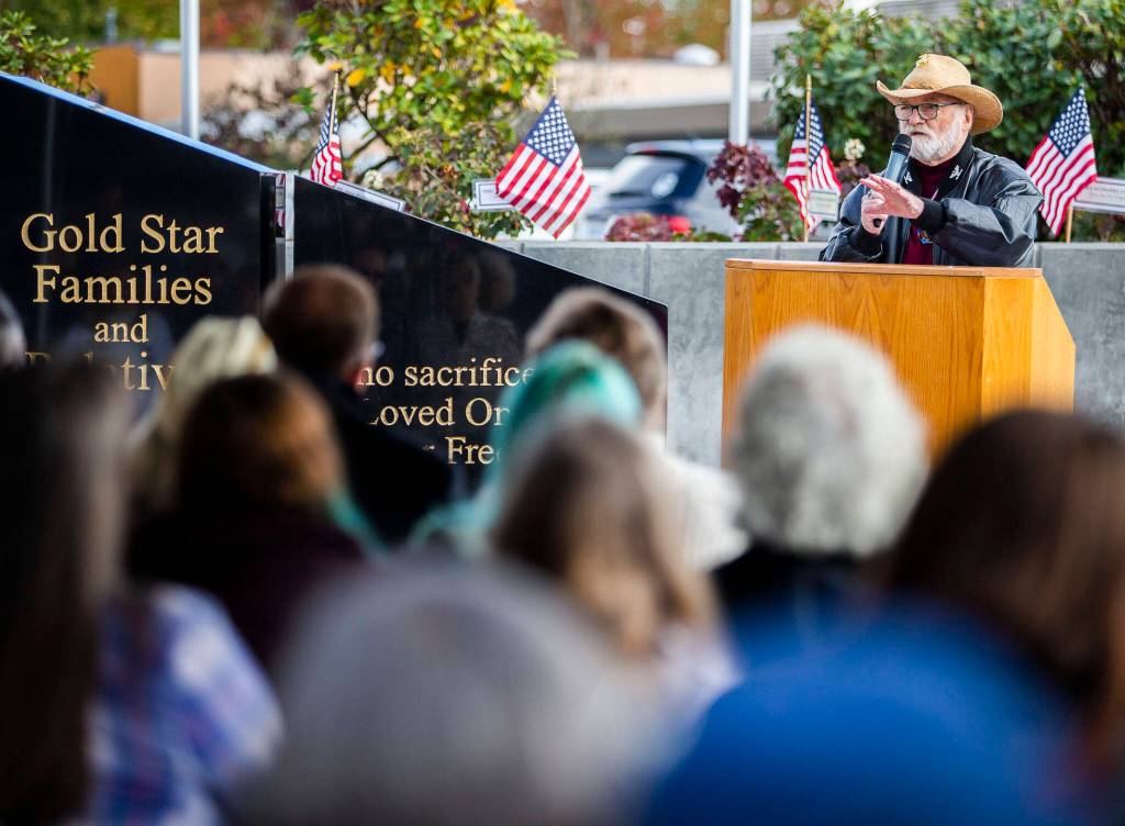 Vietnam Combat Veteran Michael Reagan speaks to those gathered at the dedication ceremony for the new Gold Star Families Memorial Monument on Wednesday, in Lynnwood. (Olivia Vanni / The Herald)