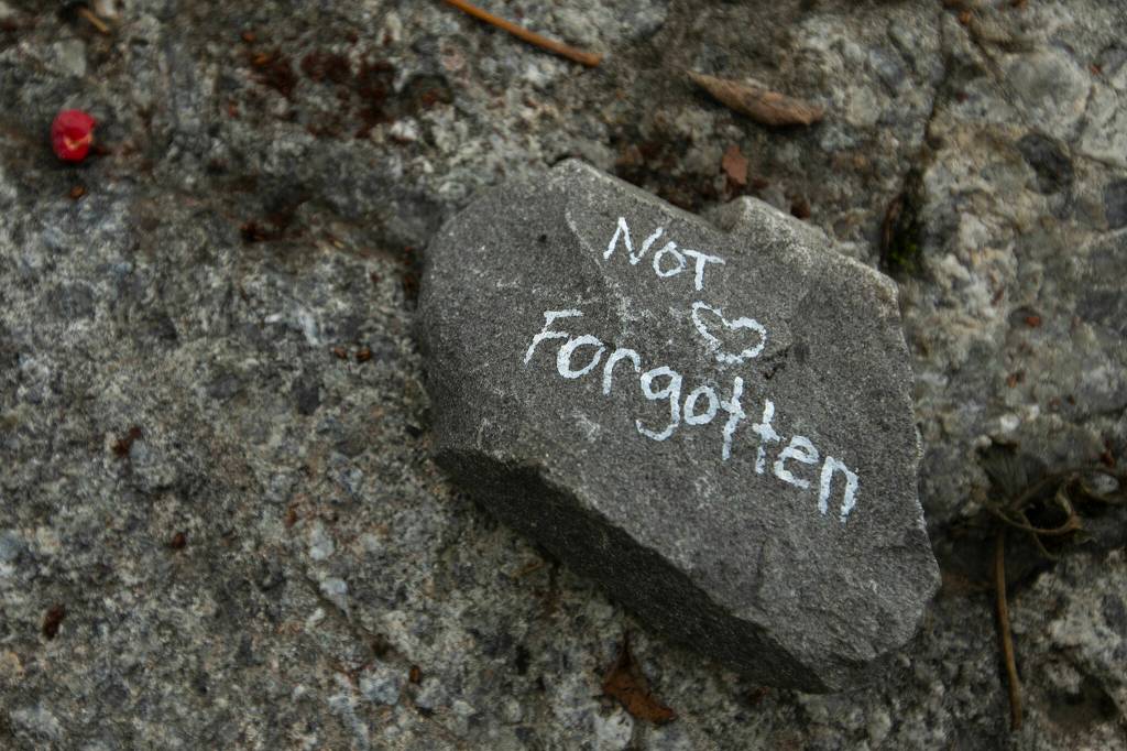 A memorial for a young girl who died years ago in the ice caves is set up within sight of the Big Four Ice Caves on Oct. 28, in Mount Baker-Snoqualmie National Forest near Granite Falls. (Ryan Berry / The Herald)