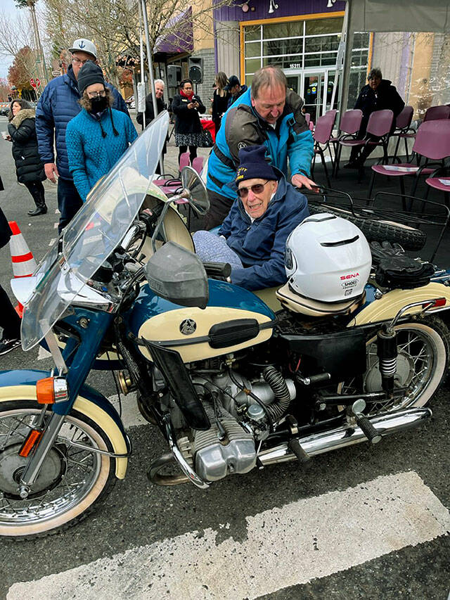 Russ Hupe rides in a sidecar alongside Snohomish County Executive Dave Somerss Ural Deco 750 motorcycle while serving as grand marshal on Friday in Mill Creeks Veterans Day parade.