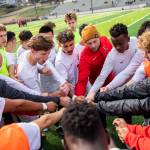 The Everett Community College mens soccer team huddles together before the start of a game against Whatcom on Oct. 23 in Everett. (Olivia Vanni / The Herald)