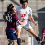 Everetts River Stewart grimaces while jumping up for a header during a game against Whatcom on Sunday, Oct. 23, 2022, in Everett. (Olivia Vanni / The Herald)
