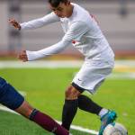 Everetts Emmanuel Escalante pushes the ball behind his leg to move around a Whatcom players tackle during a game on Sunday, Oct. 23, 2022, in Everett. (Olivia Vanni / The Herald)