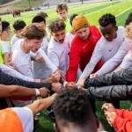 The Everett Community College soccer team sheers together before the start of their game against Whatcom on Sunday, Oct. 23, 2022 in Everett, Washington. (Olivia Vanni / The Herald)