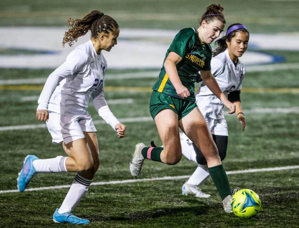 A Shorecrest player dribbles the ball down the field during game against Oak Harbor on Tuesday, Nov. 1, 2022 in Shoreline, Washington. (Olivia Vanni / The Herald)