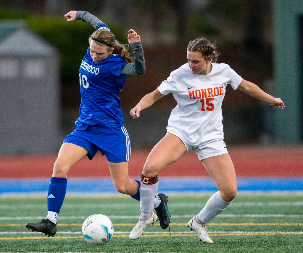 Monroes Megan Hurley pushes Shorewoods Madalyn Swartz off of the ball during game on Tuesday, Nov. 1, 2022 in Shoreline, Washington. (Olivia Vanni / The Herald)