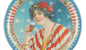A red, white and blue soda fountain tip tray might be the essence of Americana. It serves as both an advertising collectible and a patriotic decoration.