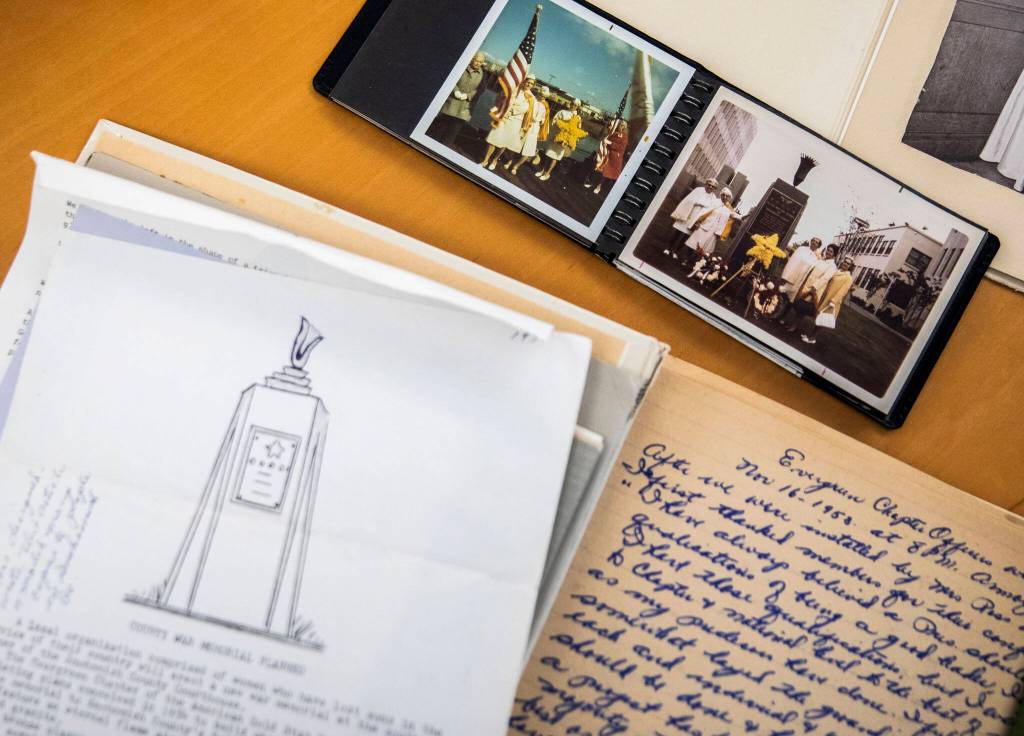 Photographs and documents of the original Eternal Flame monument on the Snohomish County Campus on Nov. 3, in Everett. (Olivia Vanni / The Herald)