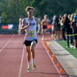 Kamiak’s Jaedyn Chase runs toward the finish line in the boys varsity gold race at the Hole In The Wall Invitational on Saturday, Oct. 8, 2022 in Arlington, Washington. (Olivia Vanni / The Herald)