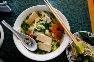 The veggie tofu pho at Phở Thanh Na in Monroe is chock-full of tender-crisp broccoli and carrots, bright aromatics and a light, flavorful broth that acts as a canvas for fresh bean sprouts, herbs, lime, chili oil and sriracha. (Taylor Goebel / The Herald)