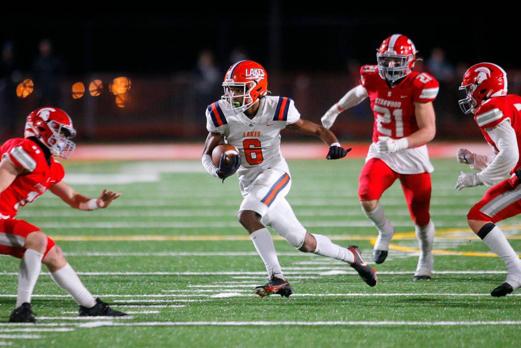 Lakes High Schools Aslan Fraser cuts through the secondary on a reception against Stanwood on Friday, Nov. 4, 2022, at Stanwood High School in Stanwood, Washington. (Ryan Berry / The Herald)