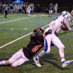 Monroe junior Deegan Chapman tackles Libertys Jaxson Thoresen on Friday, Nov. 4, 2022 in Monroe, Washington.