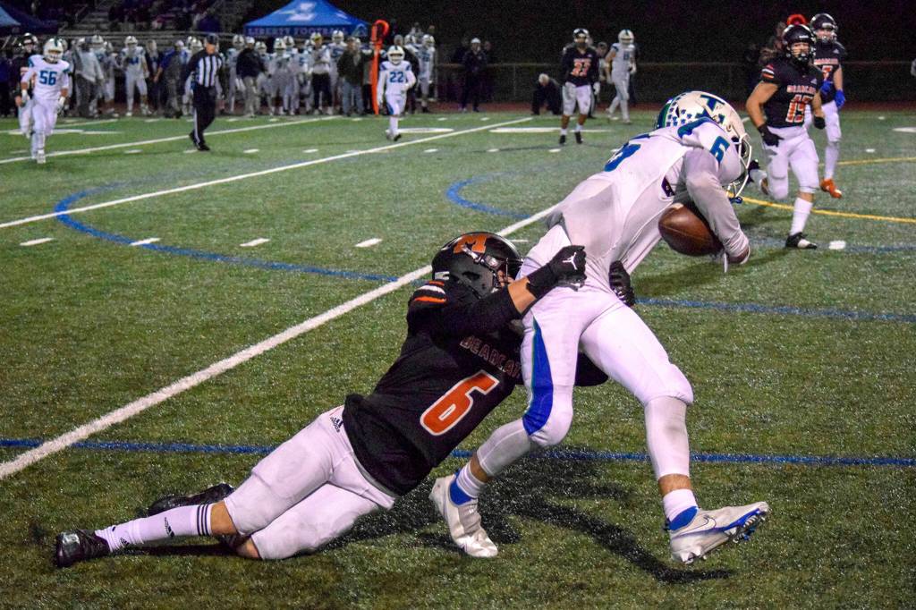 Monroe junior Deegan Chapman tackles Libertys Jaxson Thoresen on Friday, Nov. 4, 2022 in Monroe, Washington.
