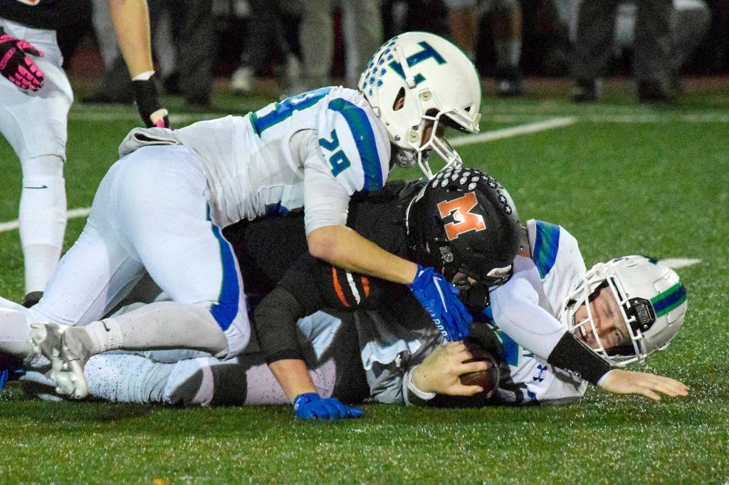 Monroe senior Kody Edelbrock tackles Libertys Rohne Klein on Friday, Nov. 4, 2022 in Monroe, Washington. (Katie Webber / The Herald)