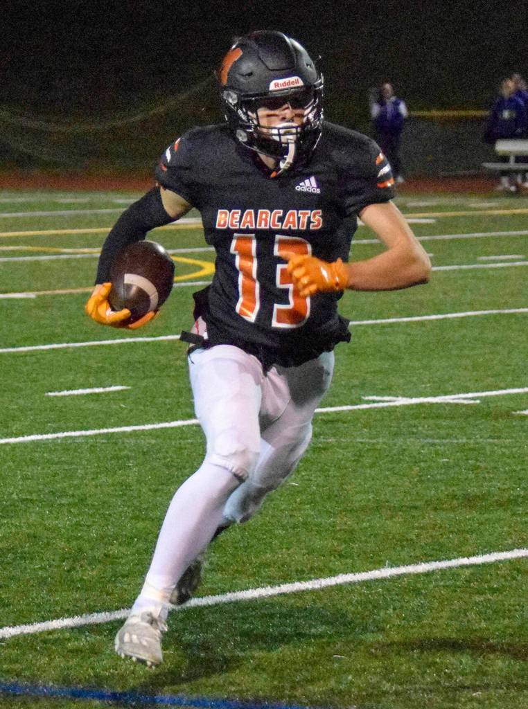 Monroe senior Eli Miller runs for a first down against Liberty on Friday, Nov. 4, 2022 in Monroe, Washington. (Katie Webber / The Herald)