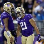 Washington running back Wayne Taulapapa (21) celebrates his touchdown against Oregon State with quarterback Michael Penix Jr. (9) during the first half of an NCAA college football game Friday, Nov. 4, 2022, in Seattle. (AP Photo/John Froschauer)