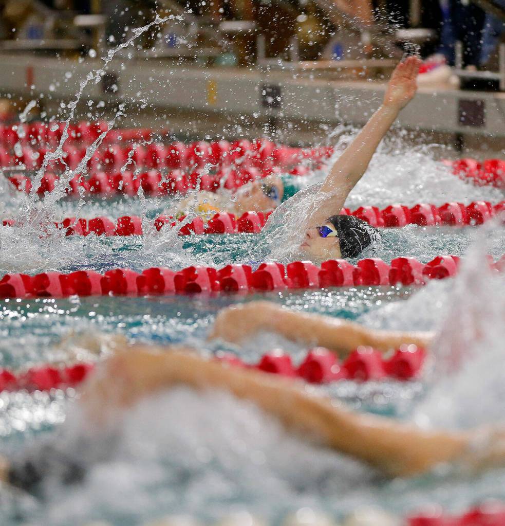 Mountlake Terrace sophomore Madeline Van Hooser nearly claims the lead in the 100 yard backstroke during the Class 4A District swim meet Saturday, Nov. 5, 2022, at Snohomish Aquatic Center in Snohomish, Washington. (Ryan Berry / The Herald)