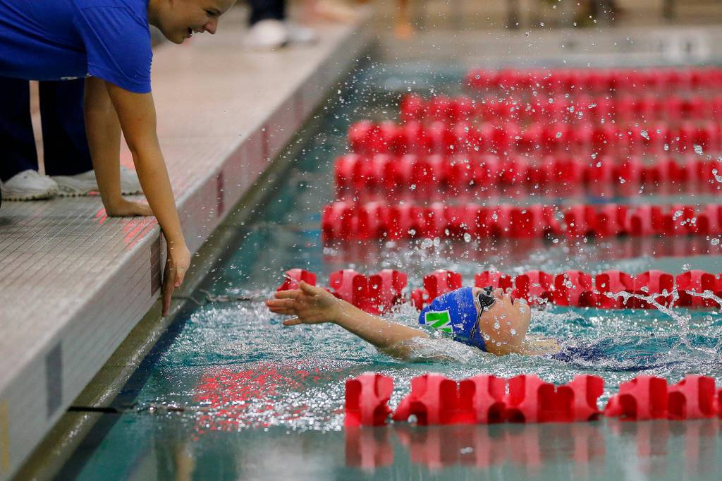 Shorewoods Kianna Fenlason reaches the turn during the 50 yard backstroke adaptive swim during the Class 4A District swim meet Saturday, Nov. 5, 2022, at Snohomish Aquatic Center in Snohomish, Washington. (Ryan Berry / The Herald)