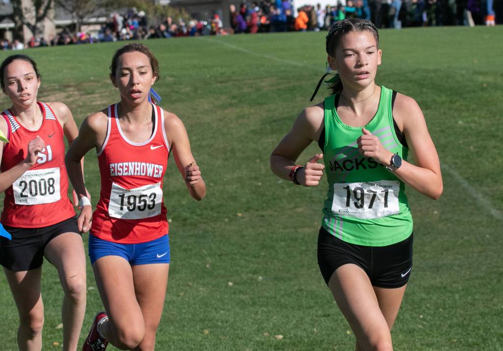 Jacksons Emma Hamm (right) finishes 12th in the 4A girls state cross country meet on Saturday at Sun Willows Golf Course in Pasco. (TJ Mullinax / For The Herald)