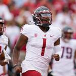 Washington State quarterback Cameron Ward (1) celebrates after throwing a touchdown against Stanford during the first half of a game Saturday in Stanford, Calif. (AP Photo/Godofredo A. Vásquez)