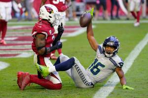 Seattle Seahawks wide receiver Tyler Lockett (16) celebrates after scoring a touchdown next to Arizona Cardinals safety Budda Baker during the second half of Sundays game in Glendale, Ariz. (AP Photo/Matt York)