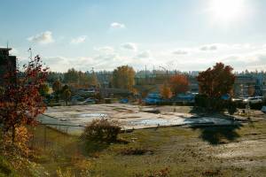 Light rail construction is seen just beyond a vacant property on Alderwood Mall Property on Sunday, Nov. 1, 2022, in Lynnwood, Washington. (Ryan Berry / The Herald)