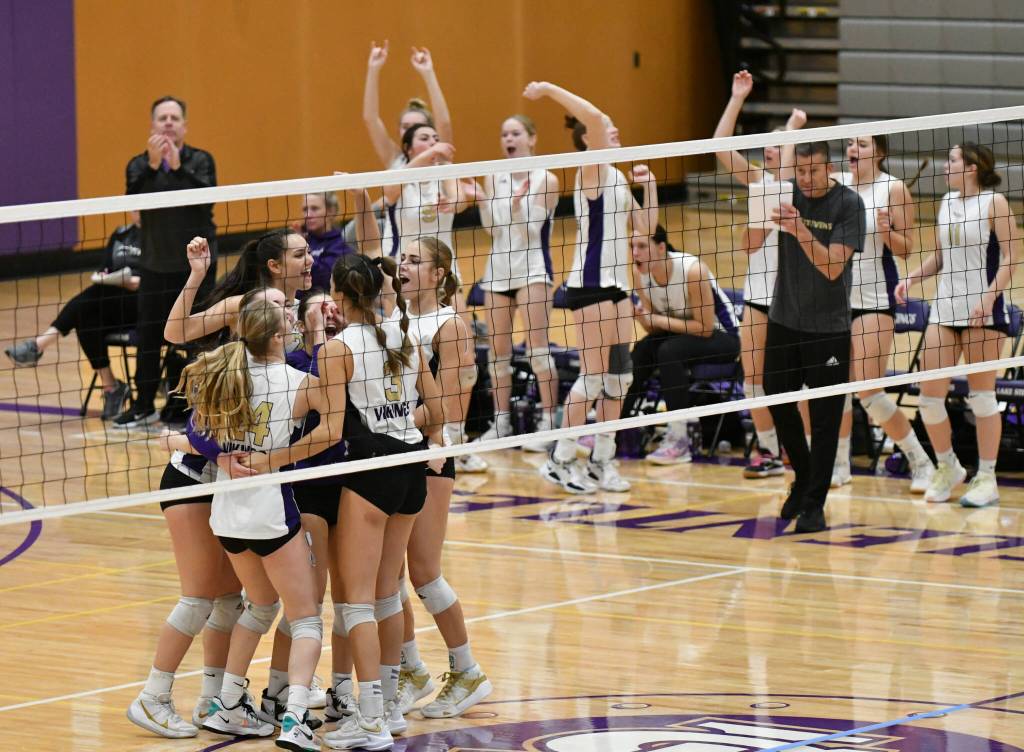 The Lake Stevens volleyball team congratulates Hayli Tri and celebrates her point during a 4A District 1/2 Tournament match against Bothell on Nov. 8, 2022, in Lake Stevens. (John Gardner / Pro Action Image)