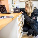 Rochelle Fahlman writes a note of encouragement to those that will be going through Reboot Recovery during an open house for the facility on Monday, in Marysville. (Olivia Vanni / The Herald)