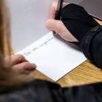 Rochelle Fahlman writes a note of encouragement to those that will be going through Reboot Recovery during an open house for the facility on Monday, in Marysville. (Olivia Vanni / The Herald)