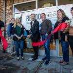 Marysville Mayor Jon Nehring cuts the ribbon at the open house for the Reboot Recovery on Monday, in Marysville. (Olivia Vanni / The Herald)