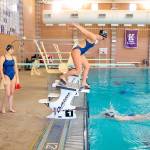 The South Whidbey swim relay team practice their relay handoffs on Wednesday, Nov. 9, 2022, at Kamiak High School in Mukilteo, Washington. (Ryan Berry / The Herald)