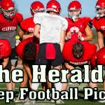 Stanwood's Michael Mascotti relays the next play to his teammates during football practice on Monday, Aug. 29, 2022 in Stanwood, Washington. (Olivia Vanni / The Herald)