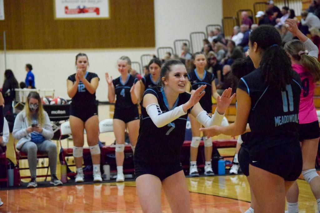 Meadowdale senior Aubrey Congdon high-fives senior Tanna Kollen during a 3A District 1 Tournament semifinal match against Monroe on Thursday, Nov. 10, 2022, at Marysville Pilchuck High School. (Katie Webber / For The Herald)