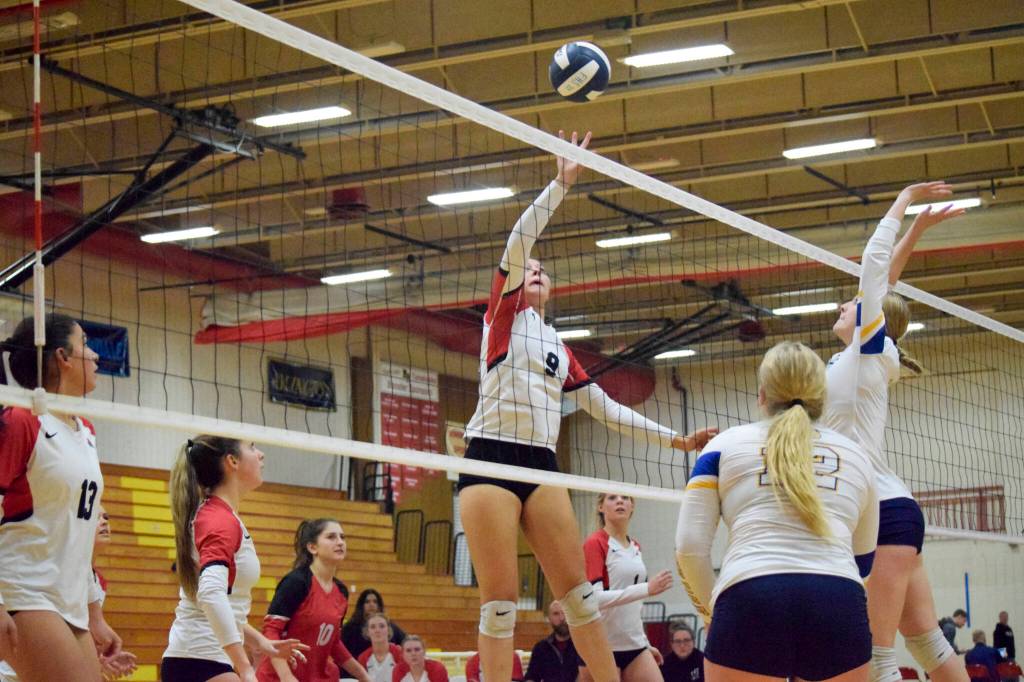 Snohomish sophomore Tyler Gildersleeve-Stiles tips the ball over the net during a 3A District 1 Tournament semifinal match against Ferndale on Thursday, Nov. 10, 2022, at Marysville Pilchuck High School. (Katie Webber / For The Herald)