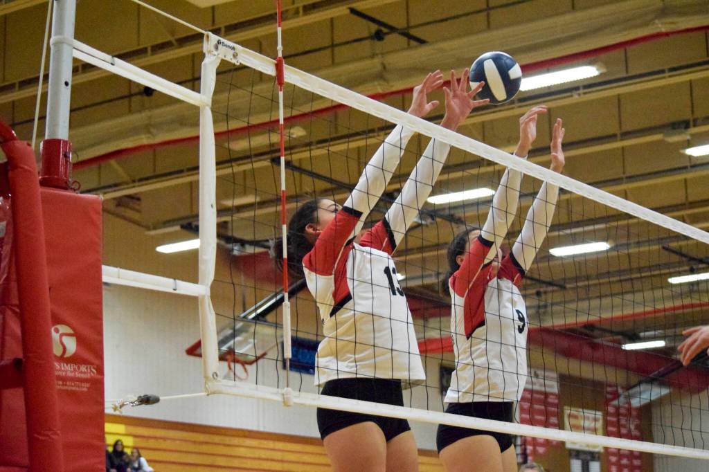 Snohomish senior Adriannah Galvan and sophomore Tyler Gildersleeve-Stiles attempt a block during a 3A District 1 Tournament semifinal match against Ferndale on Thursday, Nov. 10, 2022, at Marysville Pilchuck High School. (Katie Webber / For The Herald)