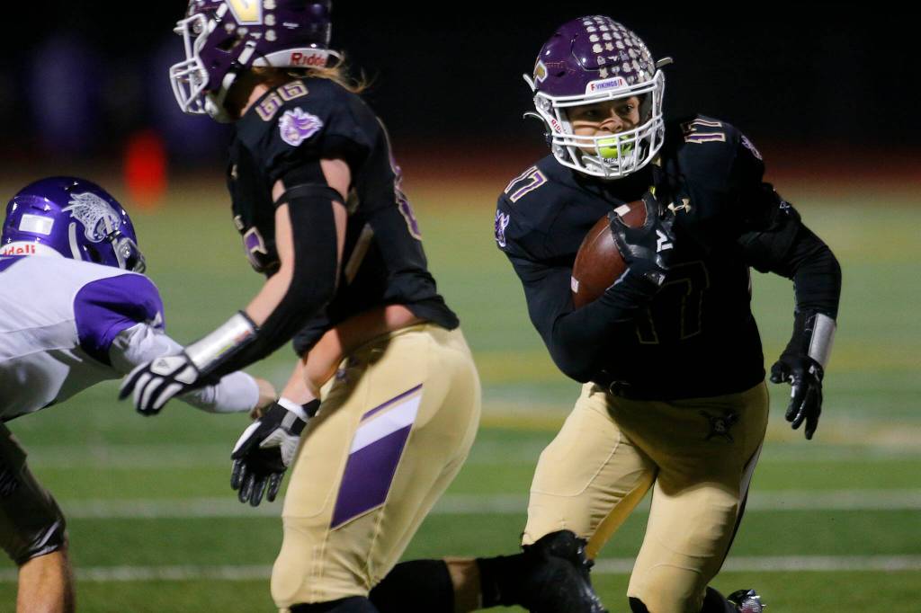 Lake Stevens Jayden Limar cuts back through a hole during a playoff game against North Creek on Friday, Nov. 11, 2022, at Lake Stevens High School in Lake Stevens, Washington. (Ryan Berry / The Herald)