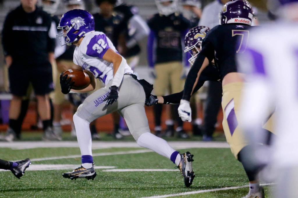 North Creeks Peyton Cunningham breaks off a long play during a playoff game against Lake Stevens on Friday, Nov. 11, 2022, at Lake Stevens High School in Lake Stevens, Washington. (Ryan Berry / The Herald)