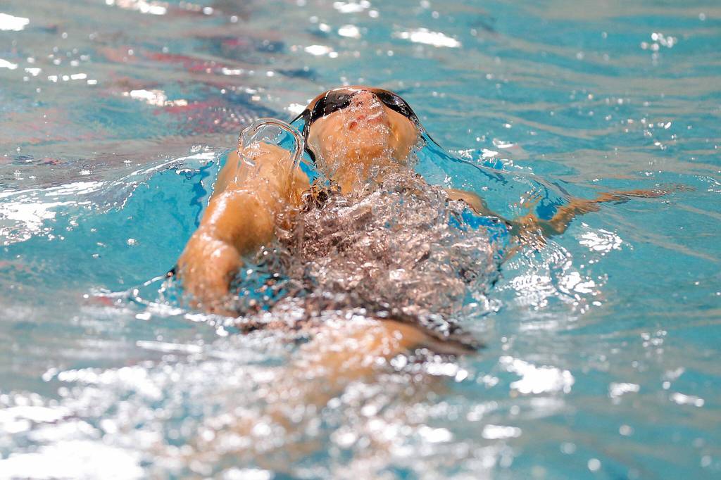 Kamiak junior Claire Smith swims in the 100 yard backstroke final during the WIAA 4A Girls State Swim & Dive Championships on Saturday, Nov. 12, 2022, at the Weyerhaeuser King County Aquatic Center in Federal Way, Washington. (Ryan Berry / The Herald)
