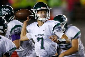 Edmonds-Woodway’s Steven Warren Jr. steps up in the pocket to make a pass against Snohomish on Friday, Sep. 23, 2022, at Snohomish High School in Snohomish, Washington. (Ryan Berry / The Herald)