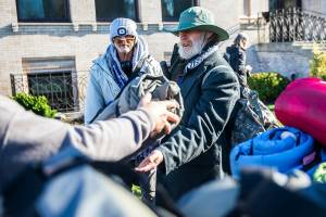 Timothy Gottschalk receives a ShelterSuit from Angel Resource Connection at the Carnegie Resource Center on Wednesday, Nov. 16, 2022 in Everett, Washington. (Olivia Vanni / The Herald)